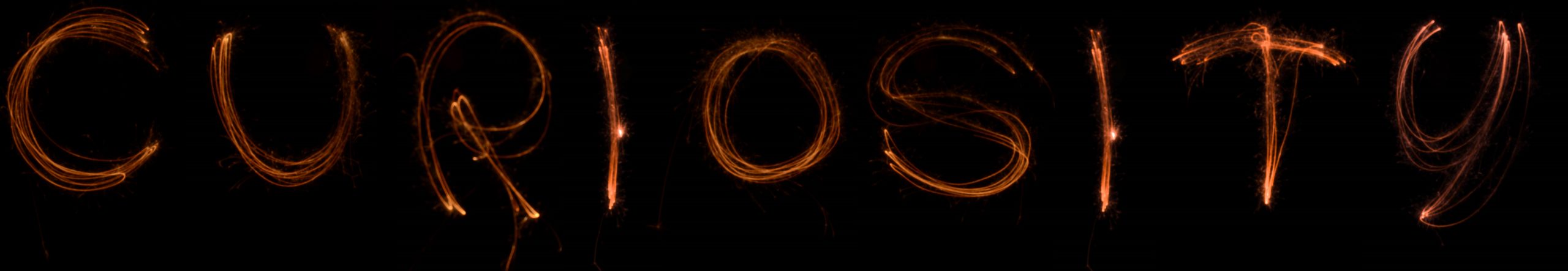 Curiosity spelled out with sparklers