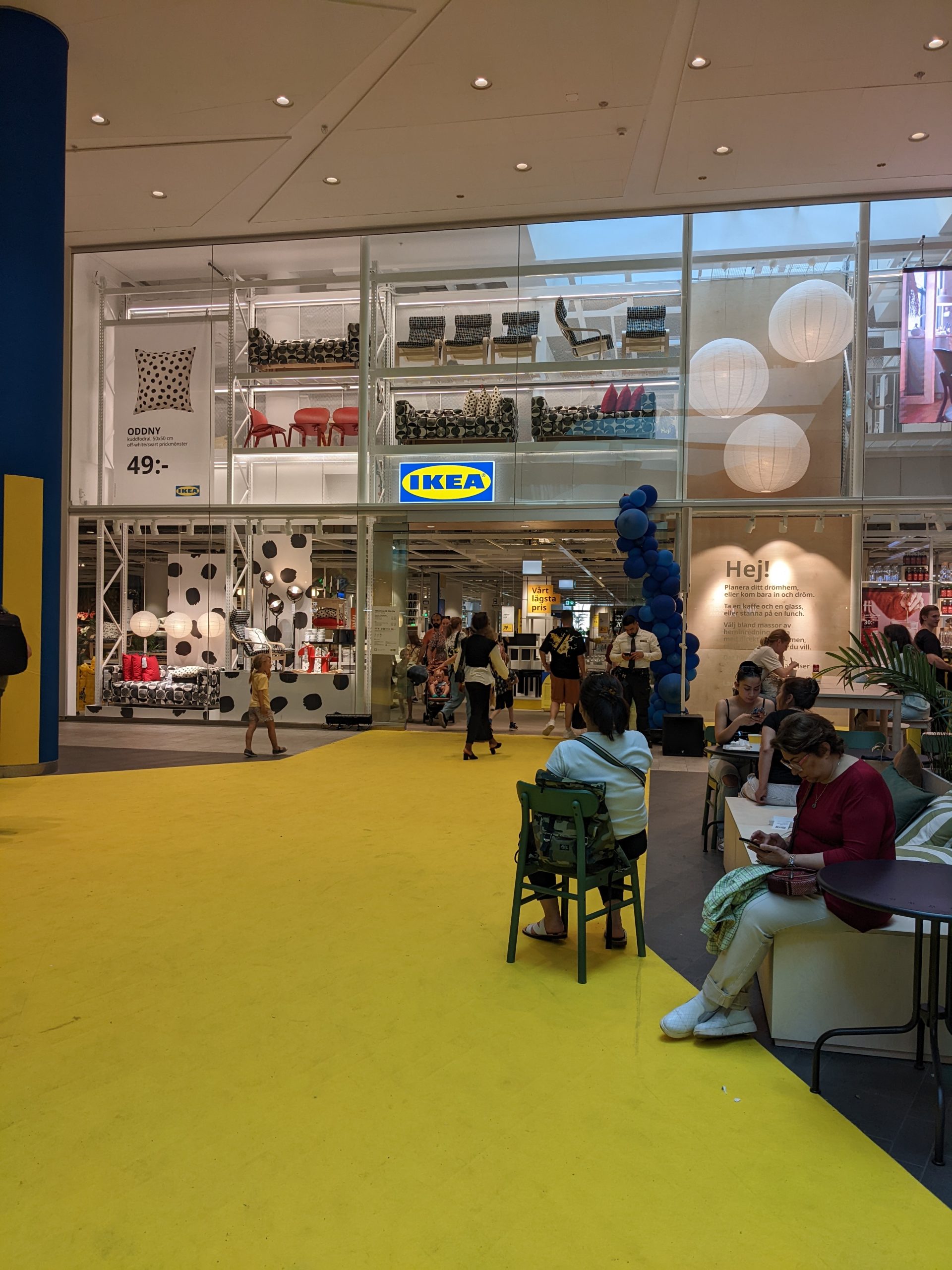 The entrance to Ikea with a yellow carpet leading to it